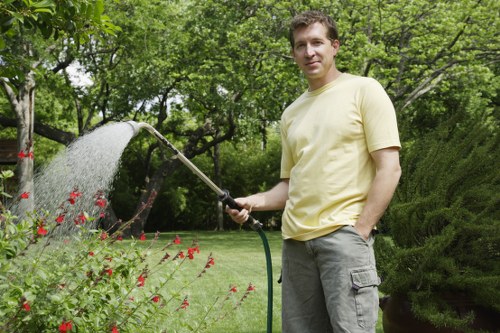 Gardener performing essential maintenance tasks in a Chigwell garden