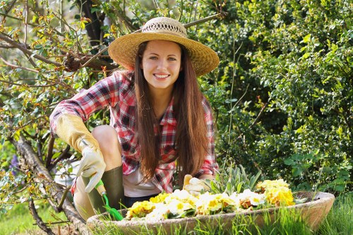Professional gardener tending to a lush Chigwell garden